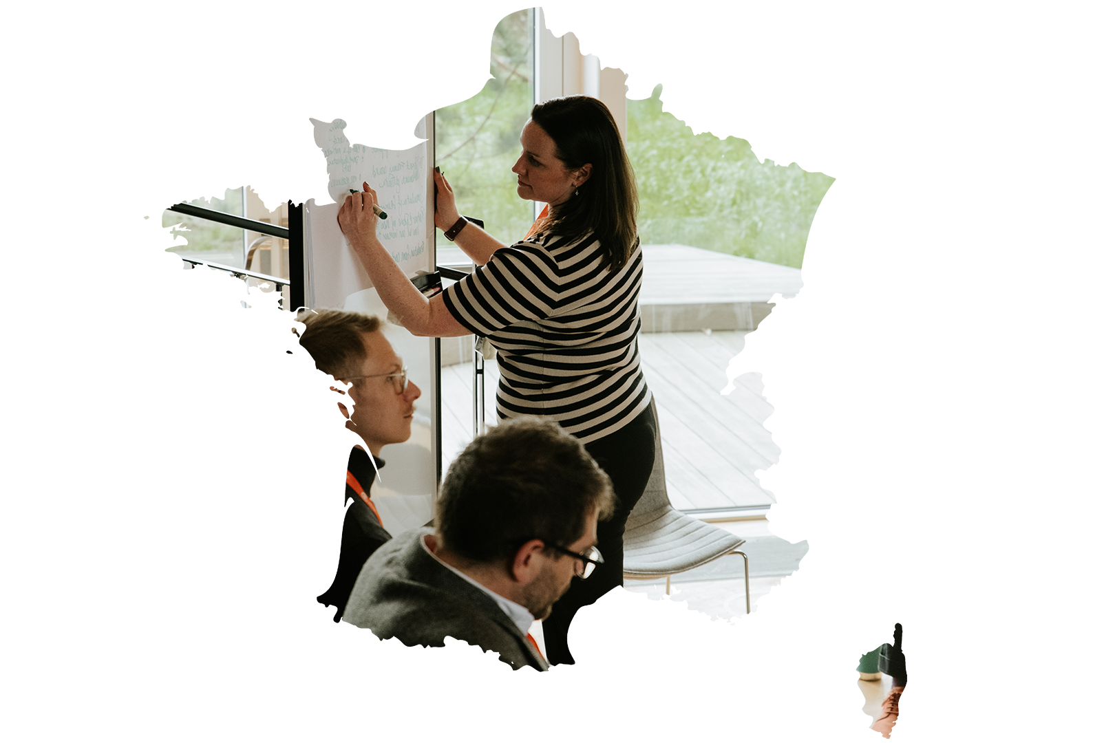 An iVentiv event attendee writes on a whiteboard, framed by a map of France