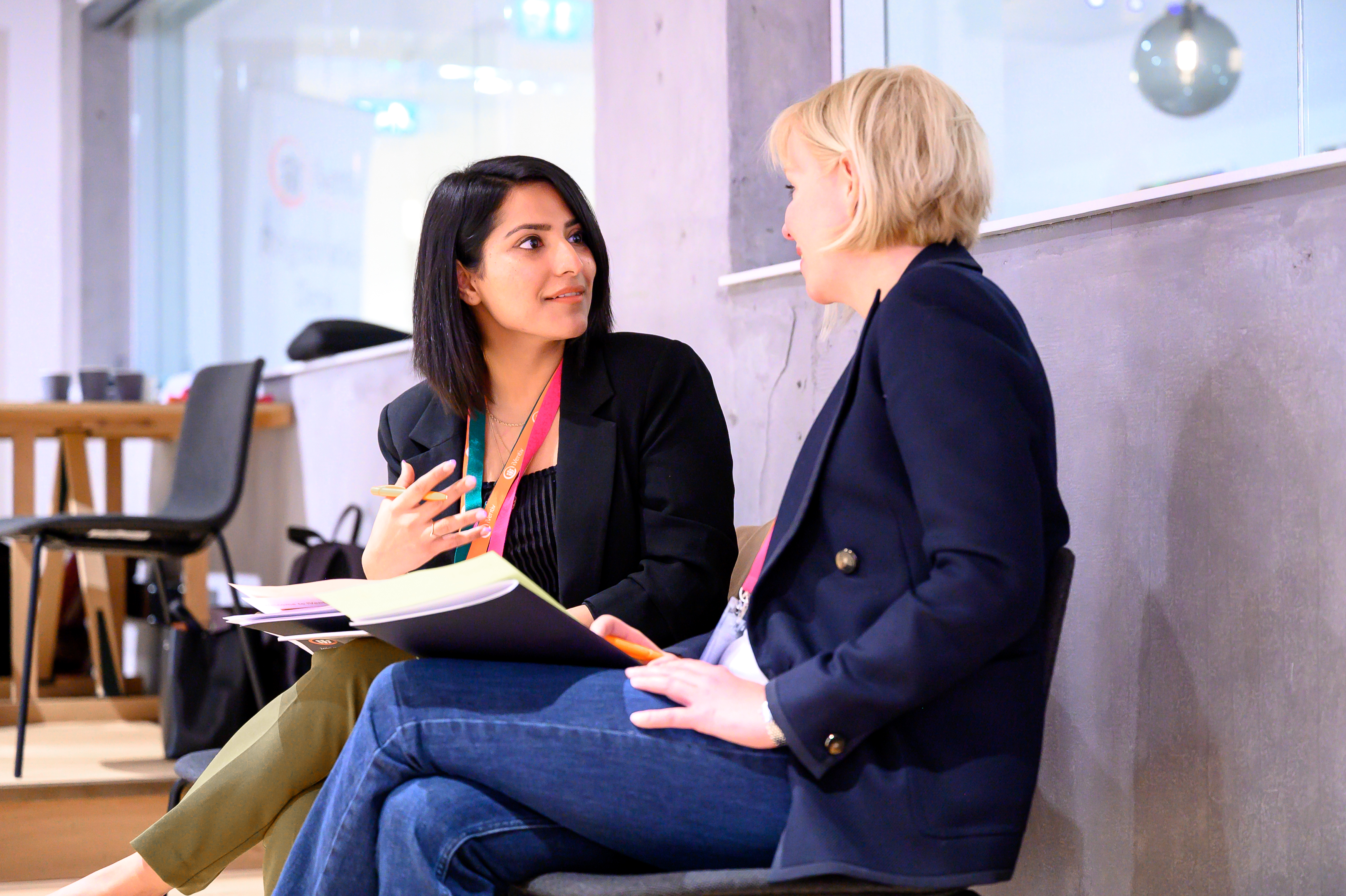 Two women in conversation at an iVentiv event