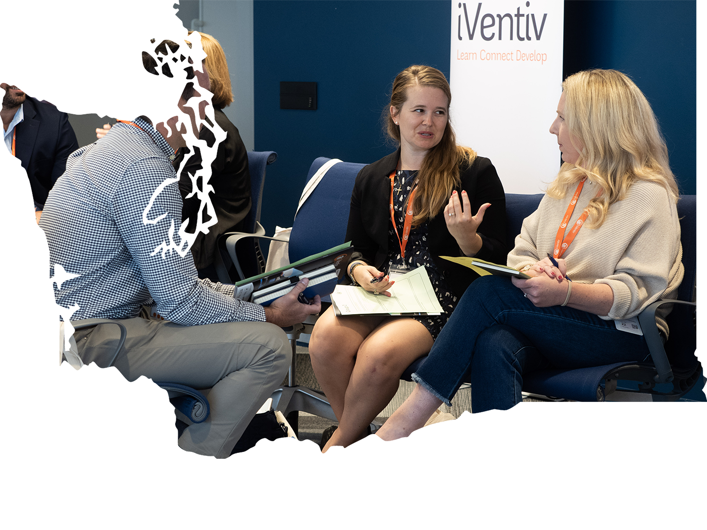 Participants in a small breakout group at an iVentiv event, framed in a map of Washington